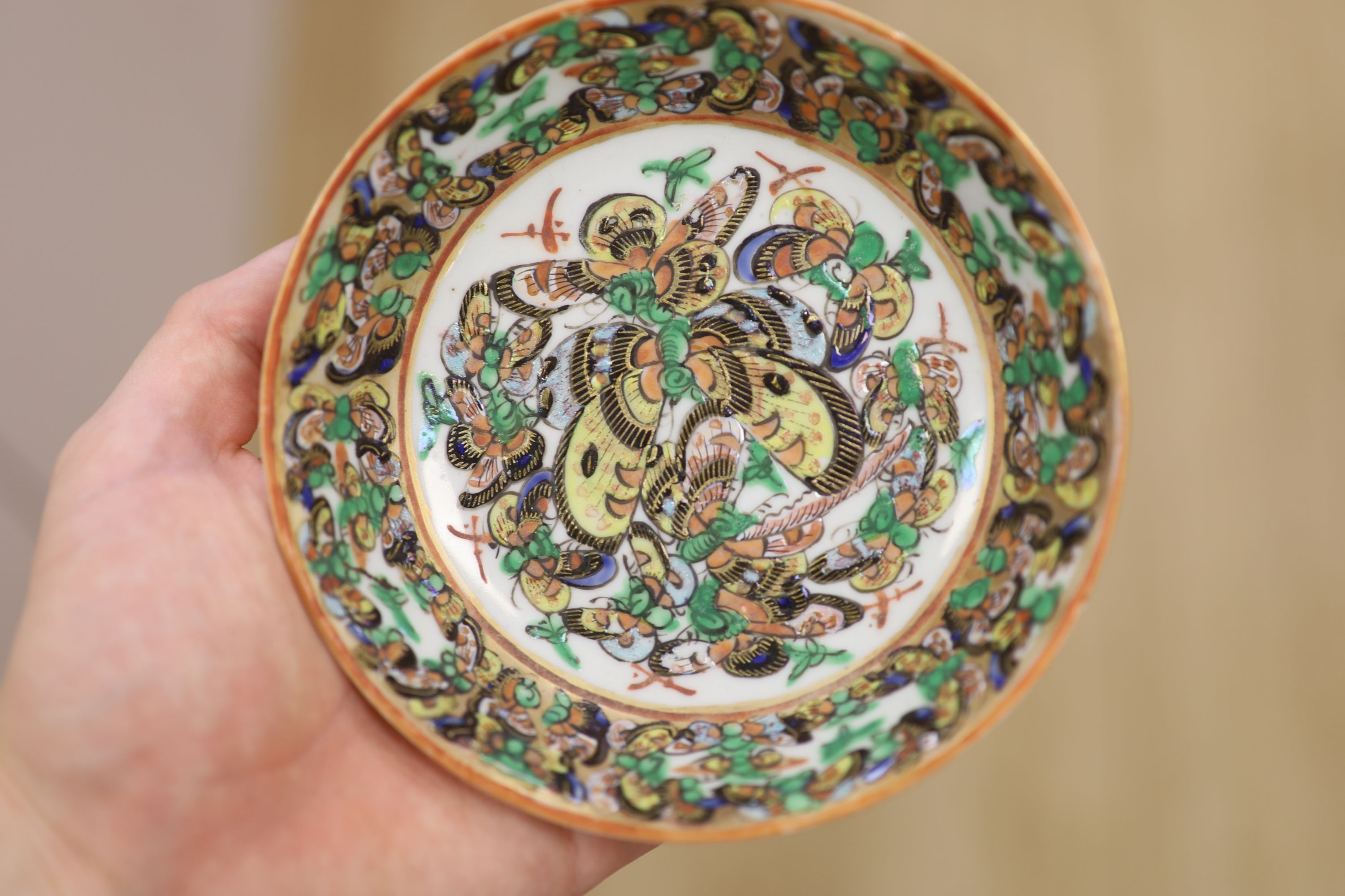 A Chinese famille rose box and cover, two vases, a sugar bowl and cover and a saucer, late 19th/early 20th century, tallest 19cm